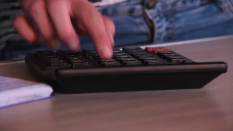 Girl hand calculator Video stock 80656483