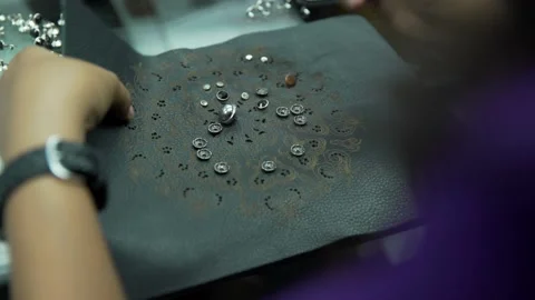 Girl hand doing button leather bag Video stock 202460800