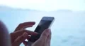 Girl Hand Touching Screen on Mobile Smart Phone. Slow Motion. HD Footage