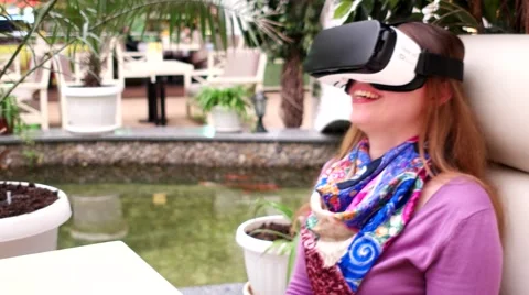 Girl hands catching virtual objects using Samsung Galaxy S7 Gear VR 2. Stock Footage 61460415