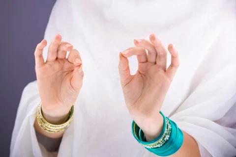 Girl hands with golden bracelets Stock Photos