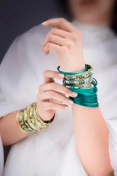 Girl hands with golden bracelets Foto stock