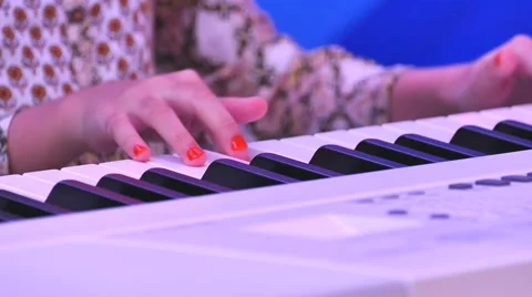 Girl hands playing electone Stock Footage 53560791