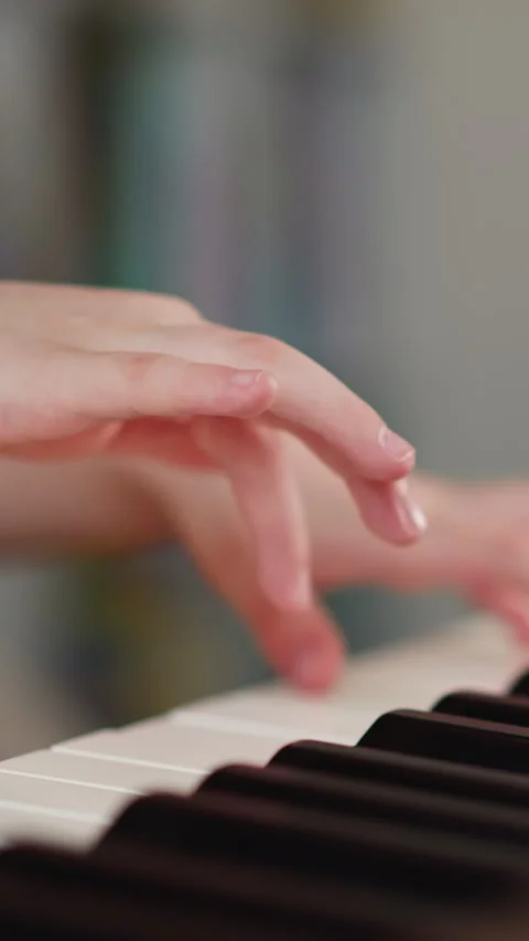 Girl hands press keys on keyboard of musical instrument Video stock 307460853