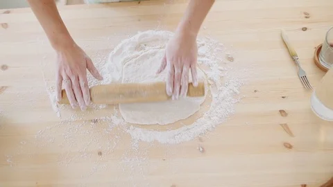 Girl by hands rolling dough for apple pie. Video stock 70941253