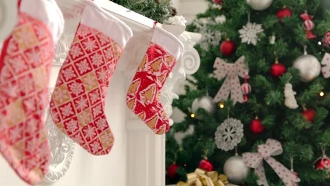 Girl hang up a stocking Stock Footage 70016307