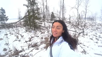 Girl Happy in the Forest while it's Snowing Stock Footage 86028353
