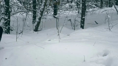 Girl Hardly Walk on Thick Snow In The Wo... | Stock Video | Pond5