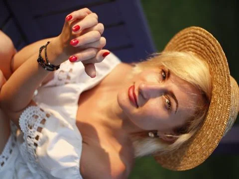 The girl in the hat posing for the camera Stock Photos