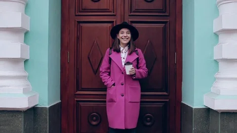 Girl in a hat smiling and drinking coffee Stock Footage 71127114
