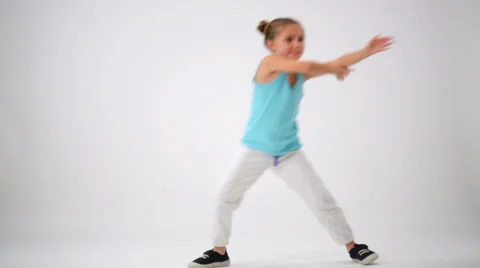 Girl have fun while doing exercises with fighting elements Stock Footage 37925365