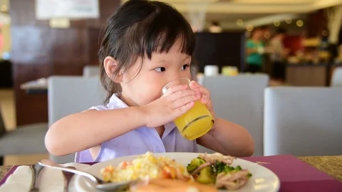 Girl having breakfast on the table Stock Footage 75531026