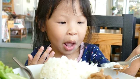 Girl having breakfast on the table Stock Footage 76544967