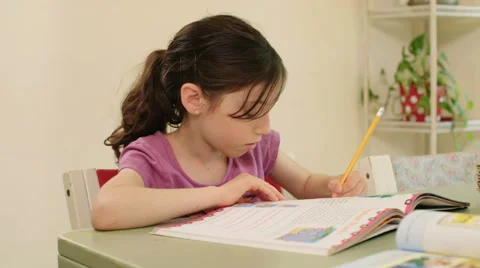 Girl having difficulties preparing her homework Stock Footage 62730492