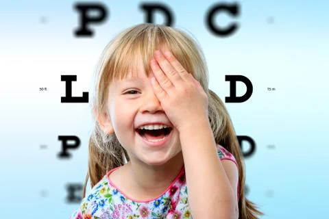 Girl having fun at vision test. Foto stock