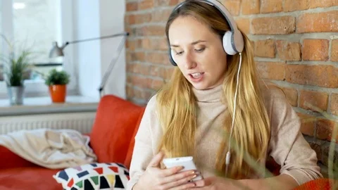 Girl having fun while listening music in her home Stock-Footage 70377548