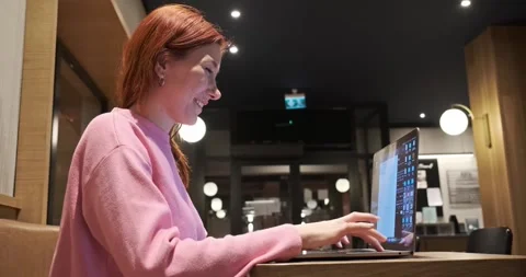A girl having fun while working remotely with a smile Stock Footage 305581446