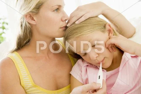 Girl Having Her Temperature Measured Stock-Fotos