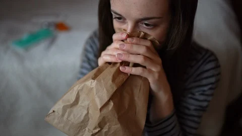 Girl having panic attack staying at home in quarantine during COVID-19 outbreak Stock Footage 128440971