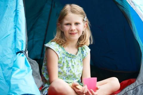 Girl Having Snack On Camping Trip Stock Photos