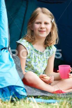 Girl Having Snack On Camping Trip