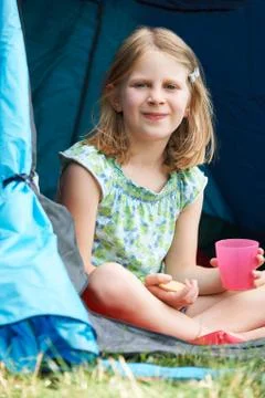 Girl Having Snack On Camping Trip Stock Photos