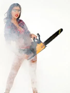 Girl holding a chainsaw Stock Photos