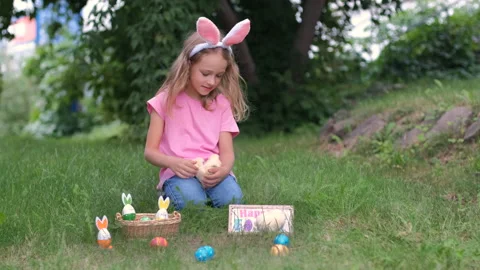 Girl Holding Chicks in Hands at Easter Outdoors Stock Footage 168235512