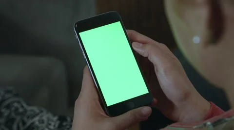 Girl Holding a green screen iphone Видео 59771251