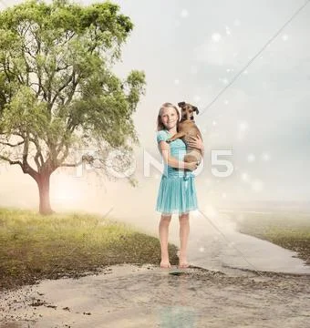 Girl holding her puppy at a magical brook Stock Photos