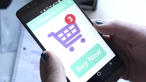 Girl Holding a Smartphone and Paying For Her Purchase Stock Footage