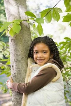 Girl holding a tree Stock Photos