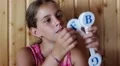 Girl holds in hands English alphabet HD Footage