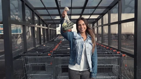 Girl holds reusable mesh string knitted shopping bag with vegetables. Healthy Stock Footage 116806884