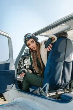 Girl in the image of a pilot Stock Photos