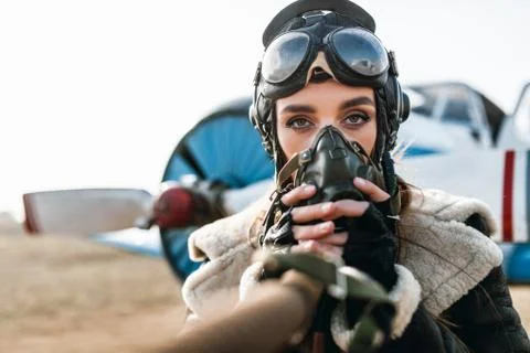 Girl in the image of a pilot Stock Photos