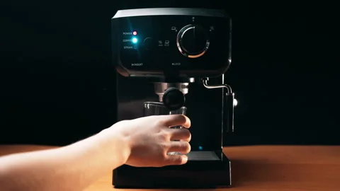 The girl inserts funnel into coffee mach... | Stock Video | Pond5