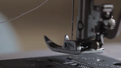 Girl inserts thread a needle Stock Footage 71296046