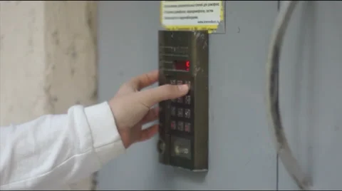 Girl introduces intercom code Stock Footage 42762463