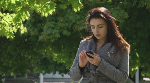 Girl iPhone to listen to wait Stock Footage 62744083