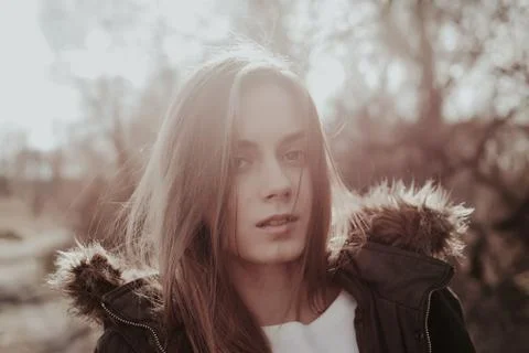 Girl in jacket looking at camera Stock Photos