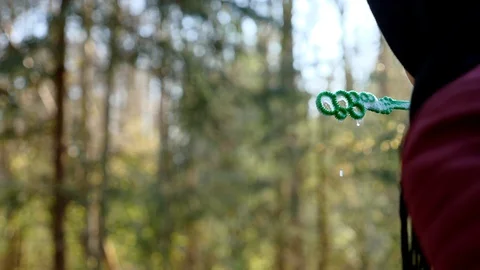 Girl in a jacket in the spring in the forest launches soap bubbles Stock Footage 129573239