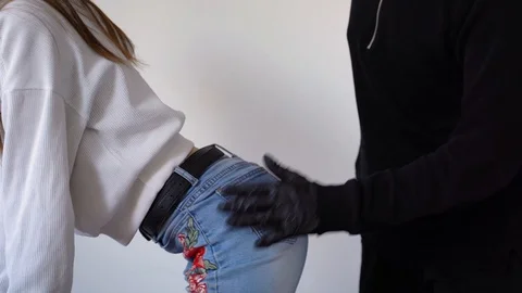 A girl in jeans is dancing with buttocks Vídeos de archivo 129555199