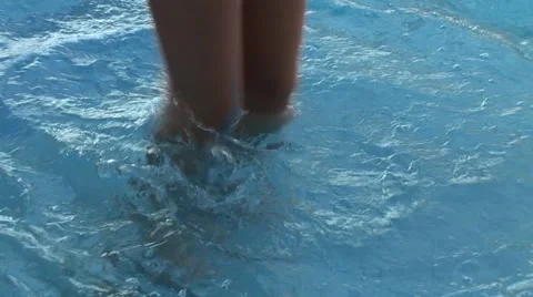 Girl jogging in the pool Stock Footage 41421986