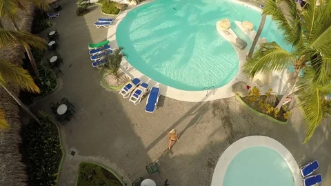 Girl Jump into pool 4K Aerial Stock Footage
