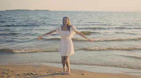 Girl jumping on the beach Stock Footage 65743733