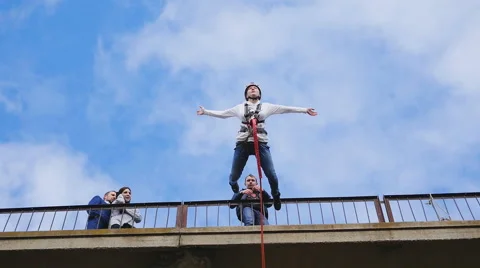Girl jumping from the bridge, face down Stock Footage 61209283