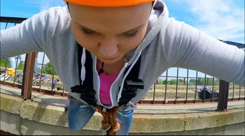Girl jumping from the bridge facing forward from Gopro   Hero 3 Stock Footage 49913031