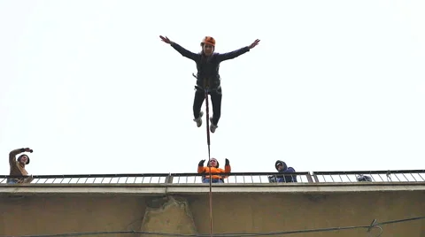 Girl jumping from the bridge facing forward with the coup Stock Footage 49921137
