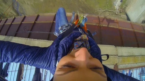 Girl jumping from the bridge tumbling sideways Stock Footage 37726259